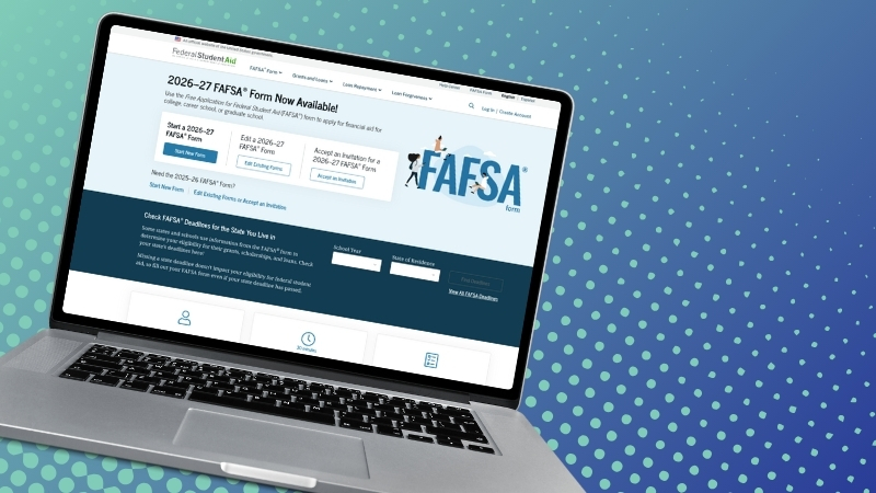 A laptop opened with the FAFSA homepage on the screen.