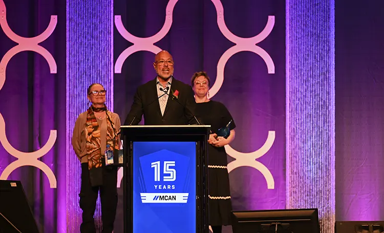 Person from Kalamazoo Promise accepting award