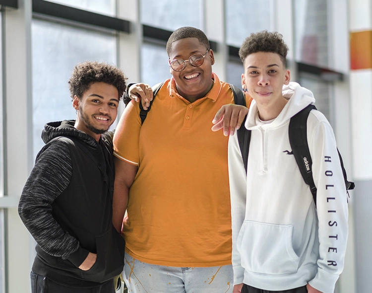3 boys posing for a picture